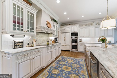 COMMANDING MASSIVE PALATIAL COLUMNS, THIS SUGARLOAF COUNTRY CLUB on TPC At Sugarloaf Golf Club in Georgia - for sale on GolfHomes.com, golf home, golf lot