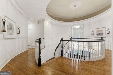 COMMANDING MASSIVE PALATIAL COLUMNS, THIS SUGARLOAF COUNTRY CLUB on TPC At Sugarloaf Golf Club in Georgia - for sale on GolfHomes.com, golf home, golf lot