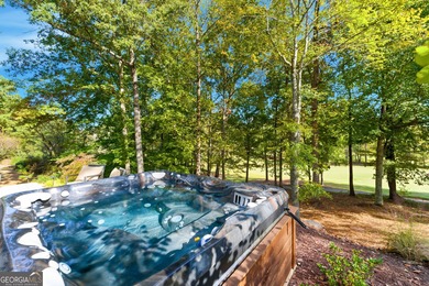 COMMANDING MASSIVE PALATIAL COLUMNS, THIS SUGARLOAF COUNTRY CLUB on TPC At Sugarloaf Golf Club in Georgia - for sale on GolfHomes.com, golf home, golf lot