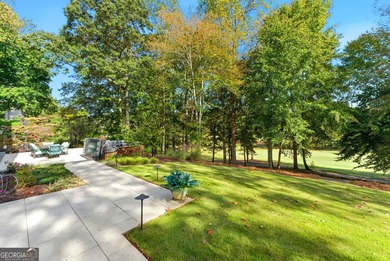 COMMANDING MASSIVE PALATIAL COLUMNS, THIS SUGARLOAF COUNTRY CLUB on TPC At Sugarloaf Golf Club in Georgia - for sale on GolfHomes.com, golf home, golf lot