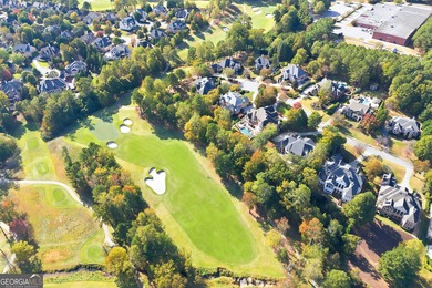 COMMANDING MASSIVE PALATIAL COLUMNS, THIS SUGARLOAF COUNTRY CLUB on TPC At Sugarloaf Golf Club in Georgia - for sale on GolfHomes.com, golf home, golf lot