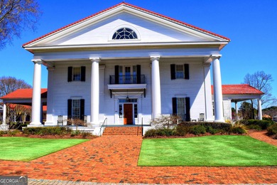 COMMANDING MASSIVE PALATIAL COLUMNS, THIS SUGARLOAF COUNTRY CLUB on TPC At Sugarloaf Golf Club in Georgia - for sale on GolfHomes.com, golf home, golf lot