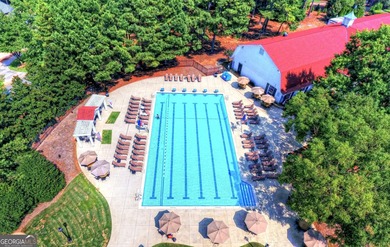 COMMANDING MASSIVE PALATIAL COLUMNS, THIS SUGARLOAF COUNTRY CLUB on TPC At Sugarloaf Golf Club in Georgia - for sale on GolfHomes.com, golf home, golf lot