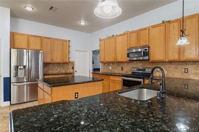 Experience refined Florida living in Homosassa with this on Sugarmill Woods Golf and Country Club in Florida - for sale on GolfHomes.com, golf home, golf lot