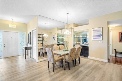 Gorgeous ground-level condo boasting picturesque panoramic lake on Broken Sound Golf and Club  in Florida - for sale on GolfHomes.com, golf home, golf lot