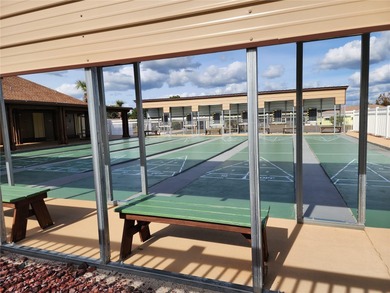 Under contract-accepting backup offers. AFFORDABLE & ADORABLE! on Duffys Golf Center in Florida - for sale on GolfHomes.com, golf home, golf lot