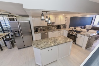 Location location!Beautiful remodeled  2 story penthouse with on Royal Palm Yacht and Country Club in Florida - for sale on GolfHomes.com, golf home, golf lot