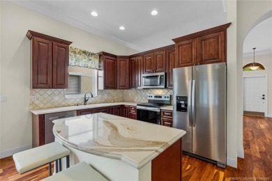 Beautiful Home in Jensen Beach Country Club situated on a on Eagle Marsh Golf Club in Florida - for sale on GolfHomes.com, golf home, golf lot