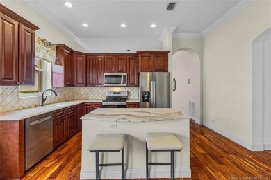 Beautiful Home in Jensen Beach Country Club situated on a on Eagle Marsh Golf Club in Florida - for sale on GolfHomes.com, golf home, golf lot