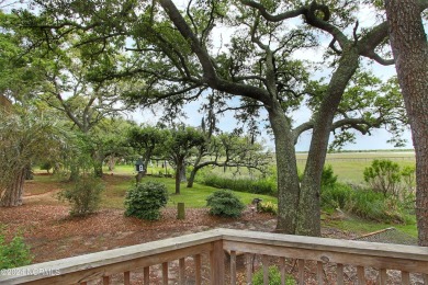 Embark on a journey to this magnificent 3 bedroom 2 bath home on Oyster Bay Golf Links in North Carolina - for sale on GolfHomes.com, golf home, golf lot