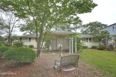 Embark on a journey to this magnificent 3 bedroom 2 bath home on Oyster Bay Golf Links in North Carolina - for sale on GolfHomes.com, golf home, golf lot