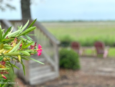 Embark on a journey to this magnificent 3 bedroom 2 bath home on Oyster Bay Golf Links in North Carolina - for sale on GolfHomes.com, golf home, golf lot