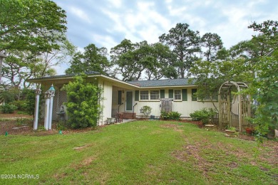 Embark on a journey to this magnificent 3 bedroom 2 bath home on Oyster Bay Golf Links in North Carolina - for sale on GolfHomes.com, golf home, golf lot