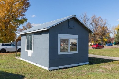 Welcome to 504 E. Fir St., where modern comfort meets small-town on Headwaters Golf Course in Montana - for sale on GolfHomes.com, golf home, golf lot