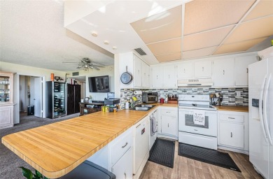 Relaxation in Paradise. The first thing to appreciate when on Isla Del Sol Yacht and Country Club in Florida - for sale on GolfHomes.com, golf home, golf lot