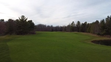 Experience elegance and functionality in this stunning on Charlevoix Golf and Country Club in Michigan - for sale on GolfHomes.com, golf home, golf lot