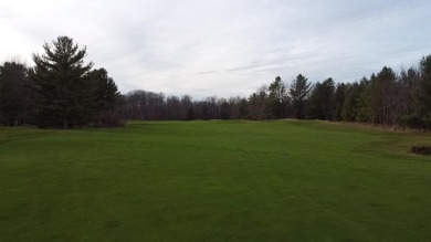 Experience elegance and functionality in this stunning on Charlevoix Golf and Country Club in Michigan - for sale on GolfHomes.com, golf home, golf lot