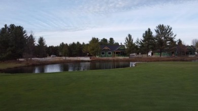 Experience elegance and functionality in this stunning on Charlevoix Golf and Country Club in Michigan - for sale on GolfHomes.com, golf home, golf lot