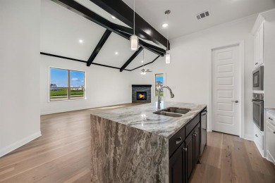 This highly sought-after single-story Altura Aspen floorplan is on Heath Golf and Yacht Club in Texas - for sale on GolfHomes.com, golf home, golf lot