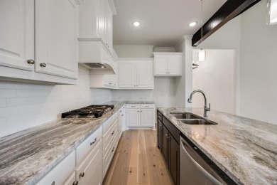 This highly sought-after single-story Altura Aspen floorplan is on Heath Golf and Yacht Club in Texas - for sale on GolfHomes.com, golf home, golf lot