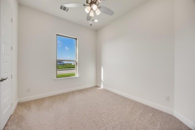 This highly sought-after single-story Altura Aspen floorplan is on Heath Golf and Yacht Club in Texas - for sale on GolfHomes.com, golf home, golf lot