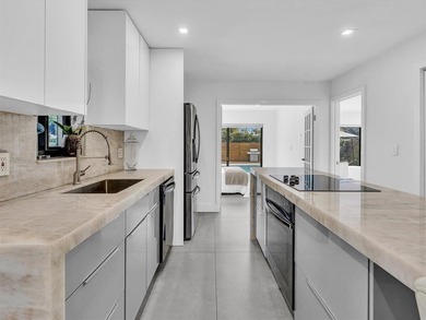 Experience luxury living in this fully remodeled golf course on Hollywood Beach Golf and Country Club in Florida - for sale on GolfHomes.com, golf home, golf lot