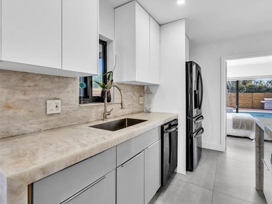 Experience luxury living in this fully remodeled golf course on Hollywood Beach Golf and Country Club in Florida - for sale on GolfHomes.com, golf home, golf lot