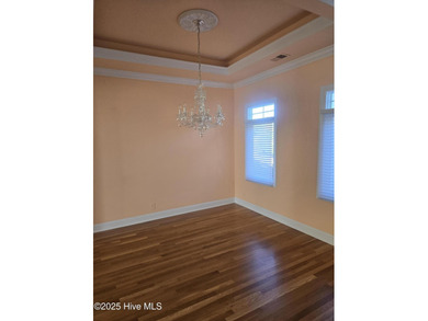 This elegant ranch-style residence offers panoramic views of on Ocean Ridge Plantation in North Carolina - for sale on GolfHomes.com, golf home, golf lot