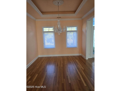 This elegant ranch-style residence offers panoramic views of on Ocean Ridge Plantation in North Carolina - for sale on GolfHomes.com, golf home, golf lot