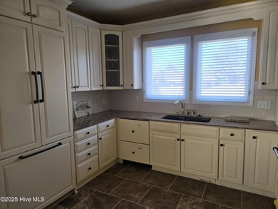 This elegant ranch-style residence offers panoramic views of on Ocean Ridge Plantation in North Carolina - for sale on GolfHomes.com, golf home, golf lot