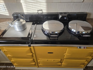 This elegant ranch-style residence offers panoramic views of on Ocean Ridge Plantation in North Carolina - for sale on GolfHomes.com, golf home, golf lot