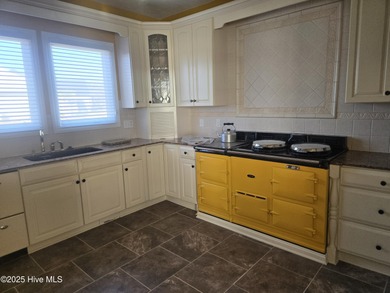 This elegant ranch-style residence offers panoramic views of on Ocean Ridge Plantation in North Carolina - for sale on GolfHomes.com, golf home, golf lot