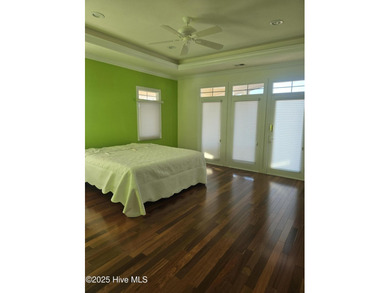 This elegant ranch-style residence offers panoramic views of on Ocean Ridge Plantation in North Carolina - for sale on GolfHomes.com, golf home, golf lot