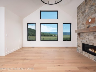 This brand-new custom home in Teton Reserve feels like a private on Teton Reserve in Idaho - for sale on GolfHomes.com, golf home, golf lot