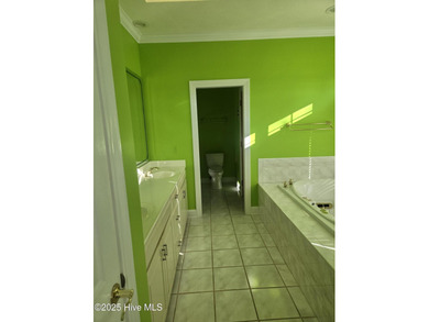 This elegant ranch-style residence offers panoramic views of on Ocean Ridge Plantation in North Carolina - for sale on GolfHomes.com, golf home, golf lot