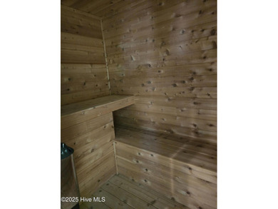 This elegant ranch-style residence offers panoramic views of on Ocean Ridge Plantation in North Carolina - for sale on GolfHomes.com, golf home, golf lot