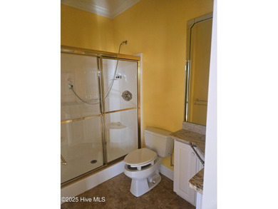 This elegant ranch-style residence offers panoramic views of on Ocean Ridge Plantation in North Carolina - for sale on GolfHomes.com, golf home, golf lot