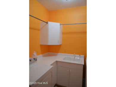 This elegant ranch-style residence offers panoramic views of on Ocean Ridge Plantation in North Carolina - for sale on GolfHomes.com, golf home, golf lot