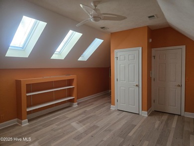 This elegant ranch-style residence offers panoramic views of on Ocean Ridge Plantation in North Carolina - for sale on GolfHomes.com, golf home, golf lot