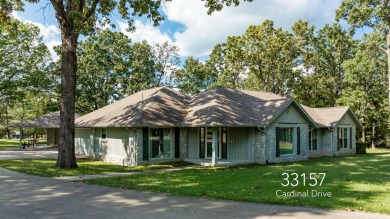 Surrounded by mature trees on a peaceful lot, this home blends on The Coves Golf Course in Oklahoma - for sale on GolfHomes.com, golf home, golf lot