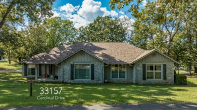 Surrounded by mature trees on a peaceful lot, this home blends on The Coves Golf Course in Oklahoma - for sale on GolfHomes.com, golf home, golf lot