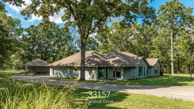 Surrounded by mature trees on a peaceful lot, this home blends on The Coves Golf Course in Oklahoma - for sale on GolfHomes.com, golf home, golf lot