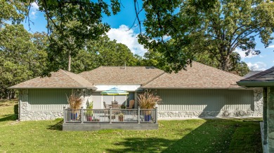 Surrounded by mature trees on a peaceful lot, this home blends on The Coves Golf Course in Oklahoma - for sale on GolfHomes.com, golf home, golf lot