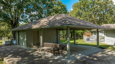 Surrounded by mature trees on a peaceful lot, this home blends on The Coves Golf Course in Oklahoma - for sale on GolfHomes.com, golf home, golf lot