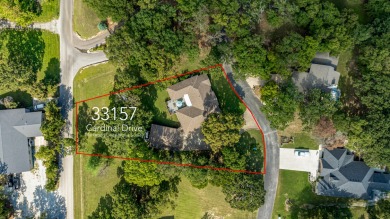 Surrounded by mature trees on a peaceful lot, this home blends on The Coves Golf Course in Oklahoma - for sale on GolfHomes.com, golf home, golf lot