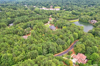 Beautifully wooded, gently sloping one-acre lot-ideal for a on The Orchard Golf and Country Club in Georgia - for sale on GolfHomes.com, golf home, golf lot
