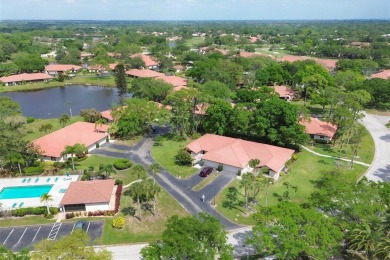 Step into care-free living with this beautiful villa, boasting on Palm Aire Country Club of Sarasota in Florida - for sale on GolfHomes.com, golf home, golf lot
