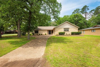 Charming and completely updated 3-bedroom cottage on a treed on Hide-A-Way Lake Golf Course in Texas - for sale on GolfHomes.com, golf home, golf lot