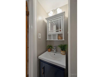 Nestled on a quiet street, this 3-bedroom, 1.5-bathroom  boasts on Twin Ponds Golf and Country Club in New York - for sale on GolfHomes.com, golf home, golf lot