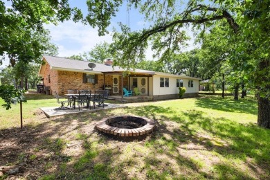 Positioned between the peaceful setting of Amon Carter Lake and on Twisted Oaks Golf Club in Texas - for sale on GolfHomes.com, golf home, golf lot